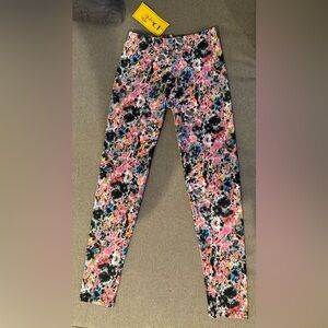 New with tags. Girls splatter leggings. Size 12/14.